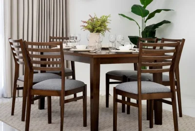 Classic upholstered dining chairs in a formal setup.