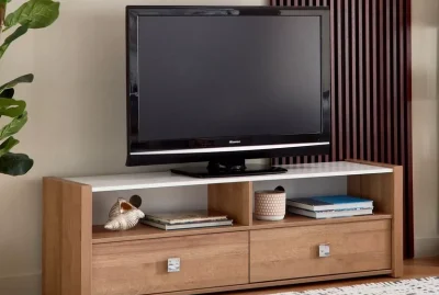 Minimalist TV table with storage drawers and a modern finish.