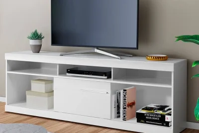 Modern white TV table with shelves for media storage.