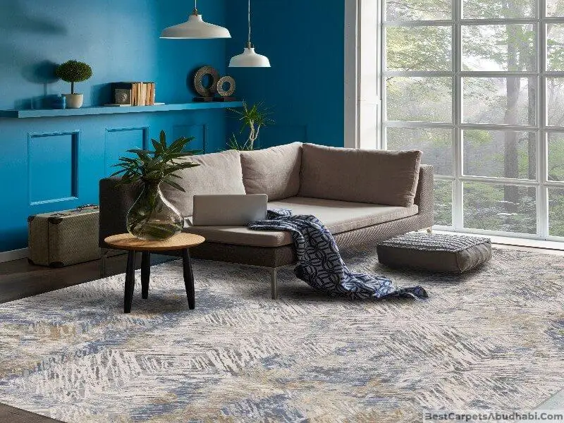 Used modern carpet in a stylish living room with blue walls and natural light.